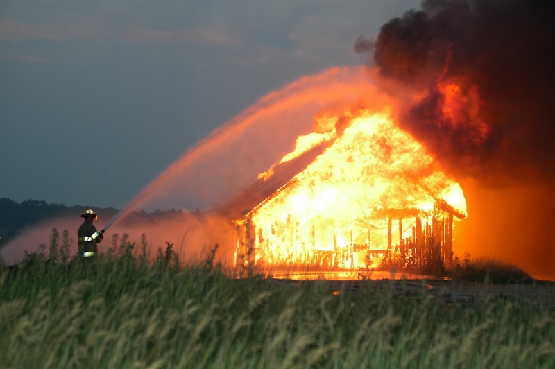 Firefighter directing a hose stream